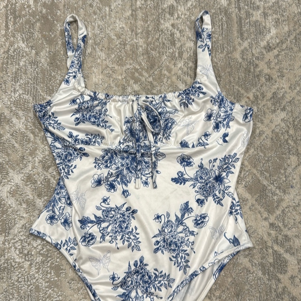 Blue and white floral bodysuit top
